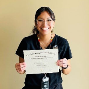 woman holding certificate smiling